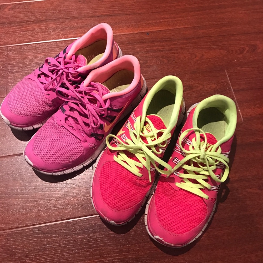 TWO pairs of pink Nike running shoes